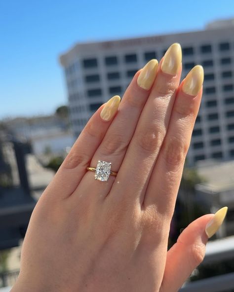 Elongated Cushion Cut💍 Elongated cushions are long, elegant stones that make incredible engagement rings. Because of their slender shapes, they look larger than many other cuts of the same carat weight✨ Save for inspo!💍 . . . engagement rings, wedding rings, ring inspo, wedding season, jewelry trends, custom jewelry, yellow gold rings, hidden halo #cushioncut #cushioncutdiamond #cushioncutengagementring #elongatedcushion #weddingrings #ringinspo #jewelrydesign #customrings 2 Carat Elongated Cushion Cut, Elongated Cushion Engagement Ring Gold Hidden Halo, Elongated Cushion Engagement Ring With Wedding Band, Elongated Cushion Engagement Ring Gold, Trending Engagement Rings For 2024, Wedding Rings Gold Band, Cushion Engagement Ring Gold, Cushion Cut Engagement Ring Gold, Elongated Cushion Engagement Ring