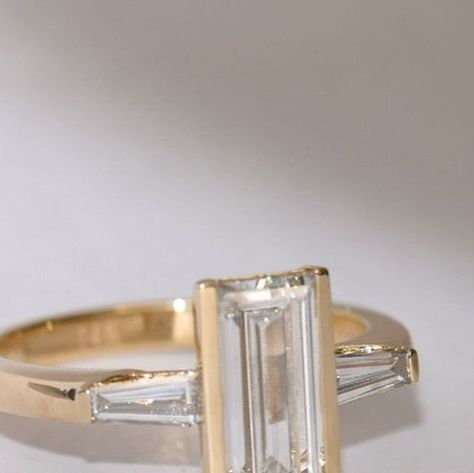 Jewelry Redesign and Custom Heirlooms on Instagram: "Our modern baguette engagement ring. Designed for one very special bride, this stunner features a 2 carat center stone and is accompanied by tapered baguettes. 🥖 Send us a message to start designing the ring of your dreams." Emerald Cut Tapered Baguettes, Jewelry Redesign, Baguette Engagement Ring, Baguette Cut Diamond, Baguette Cut, 2 Carat, Emerald Cut, Baguette, Diamond Cuts