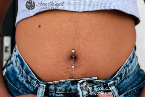 The best part of seeing a healed piercing we did is getting to add even more sparkles to it! 💫💎💫 This client came in sporting a happy and healed Floating Navel done by Josh and was looking to add a dangly charm! We custom made this titanium chain to fit onto their existing @anatometalinc curve, and topped it off with a matching White CZ charm from @industrialstrength ! Keep up with the summer fun by getting yourself a new piece for your healed piercing 😍 📷: @50percentsnakes . . . #safepie... Floating Navel, Healed Piercing, Navel Piercing, Above And Beyond, Keep Up, Body Jewelry, Summer Fun, Body Art, Piercings