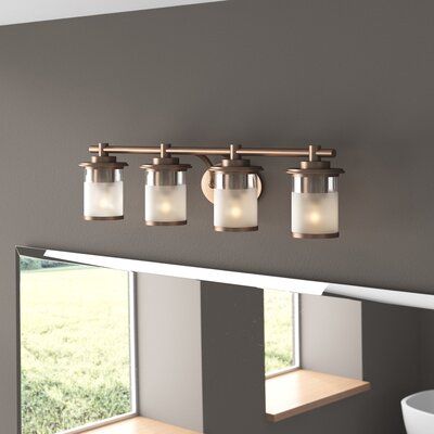 If your powder room needs a pick-me-up, This 4-light vanity light brings both styles and shine to your spa-worthy space. It's crafted from metal with a sleek chrome or gold finish, and its frame features an oval backplate and a tubular bar that extends just over 32" long. The bar sits four lights, each highlighted by a cylindrical metal and glass shade that can be installed facing up or down. Inside each shade, it houses one medium-base bulb up to 100W. | Zipcode Design™ Davis 4-Light Vanity Lig Light Vanity, Gold Chrome, Bathroom Vanity Lighting, Vanity Light, Satin Brass, Vanity Lighting, Yellow And Brown, The Bar, Powder Room