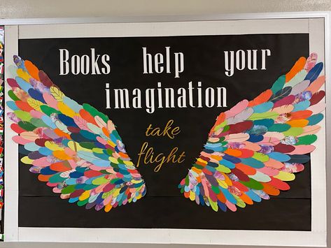 Library bulletin board with multicolor wings and text that says “Books help your imagination take flight” Angel Wings Bulletin Board, Feather Bulletin Board, Bird Theme Decorating Ideas, Imagination Bulletin Board Ideas, Watch Us Soar Wings Bulletin Board, Wings Bulletin Board Ideas, Reading Gives You Wings Bulletin Board, Wing Bulletin Board, Wings Bulletin Board