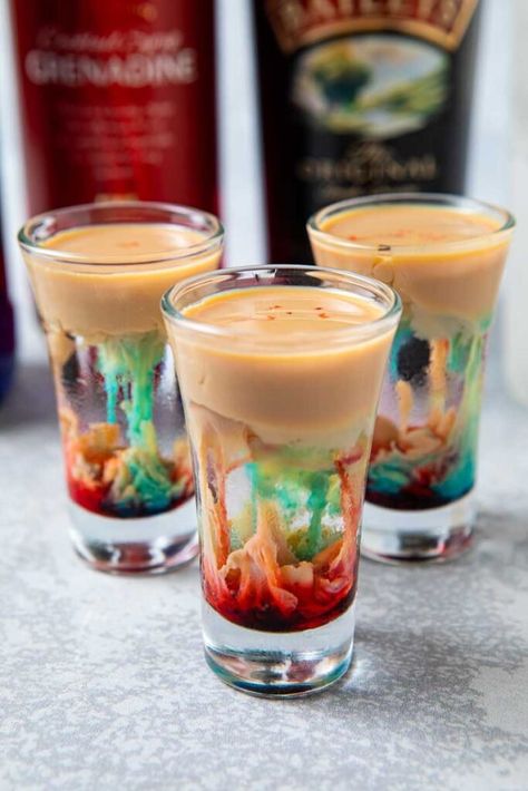 If you have a morbid taste, this creepy drink might just be the perfect tonic! The alien brain hemorrhage shot is becoming THE Halloween drink and is perfect for those who like their drinks artfully grim. |best shot | Halloween cocktails| #halloween #creepy Drinks Com Vodka, Halloween Alcohol, Halloween Shots, Halloween Party Drinks, Recetas Halloween, Halloween Drinks Alcohol, Halloween Drink, Halloween Fest, Themed Drinks