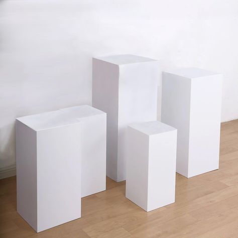 PRICES MAY VARY. Quantity: Set of 5 Pedestal Stands Material: Metal Color: White Style: Rectangular Heights: 20", 22", 24", 29.75", 34" Widths: 9", 10", 11.5", 13", 14" Thickness: 2mm Pedestal Weight Capacity: 55-60 lbs Features: Smooth surface, hollowed middle, stackable, easy storage and transportation PREMIUM QUALITY: These pedestal risers, display boxes are made from high-quality premium material. This elegantly shimmering piece comprises shiny material crafted with the utmost perfection. To Catered Food, Wedding Pillars, Prop Box, Wooden Cake Stands, Pedestal Stand, Graduation Parties, Cake Display, Aisle Decor, Themed Decor