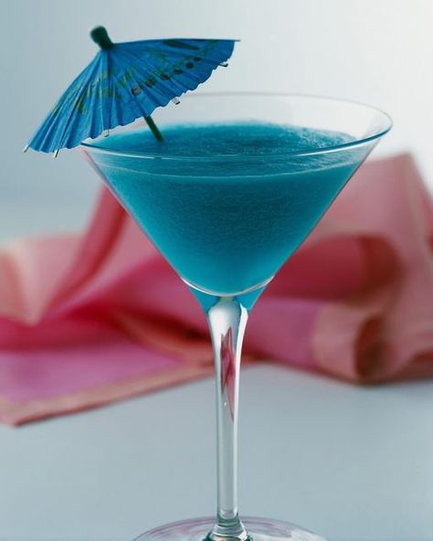 Blue Hawaiian Cocktail, Cocktail Umbrella, Hawaiian Cocktails, Tiki Bars, Cocktail Umbrellas, Blue Drinks, Cocktail Serving, Blue Food Coloring, Blue Cocktails