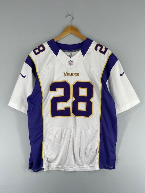 Get your hands on this vintage Minnesota Vikings NFL fan apparel featuring an Adrian Peterson jersey. Show your support for the American football team... Rugby T Shirts Design, Cool Jersey Design Football, Vintage Nfl Shirts, Vintage Jersey Football, Vintage Football Jersey Outfit, American Football Jersey Design, Nfl Jersey Outfit, Football Jersey Design, American Football Shirt