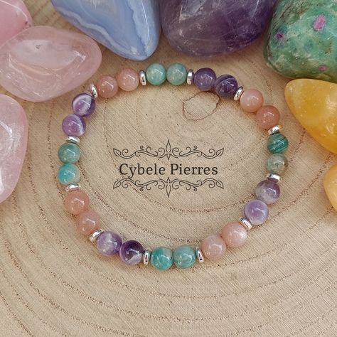 Bracelet Pastel - Amazonite, Pierre de Soleil et Améthyste (6mm) - 17cm ★2 Bracelets Achetés = Le 3ème offert ! ★ (Non cumulable avec d'autres réductions ou code promo) Pierre de Soleil naturelle : Apporte la vitalité, l’abondance et l’énergie. Aide à surmonter la peur et le stress. Pierre de joie interne. Elle diffuse la bonne humeur, joie, optimis...#Treasures #Unveiling #of #Exploring #Natures #Gemstone #of #Beauty #StatementJewelry #Exploring #the #Jewelry #the #Gemstone #the #of #Allure Creativity Crystals, Bracelet Photo, Bracelets Design, The Beauty Of Nature, Bracelet Crystal, Crystal Magic, Chakra Jewelry, Semi Precious Beads, Chakra Bracelet