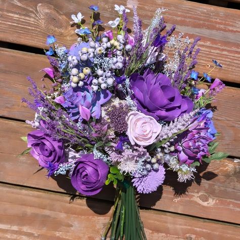 Shades of purple pop with vibrancy in this wild bouquet! We used @unicornspitstain for each shade and tint - we even used SPARKLING violet! Those roses shimmer! Greenery and filler from @pioneerimports ! Our luxury wood flowers have never looked better! Perfect bridal bouquet! #lttlteapotdesigns #luxurywoodflowers #littleteapotdesigns #woodflowers #woodflowerflorist #weddingtrends #weddinginspo #weddinginspiration #weddingstyle #bride #bridal #bouquet #flowers #floraldesign #florist #maryla... Purple Lilac Bouquet, Violet Bouquet, Wild Bouquet, Hoco Inspo, Purple Bouquets, Lilac Bouquet, Bridal Bouquet Flowers, Purple Bouquet, Wood Flowers