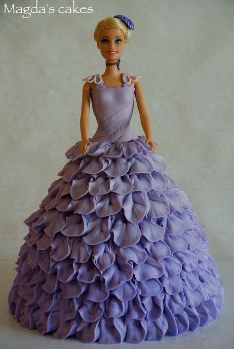 I love doll cakes (or as I should say, I love to play dress-up); This one is dressed in light purple petal dress in buttercream (I decided to try something else than regular buttercream rosettes or ruffles) Princess Doll Cake Buttercream, Barbie Cake Purple, How To Make A Barbie Dress Cake, Barbie Doll Dress Cake, Purple Barbie Cake, Barbie Cake Dress, Clown Cones, Doll Cake Buttercream, Princess Dress Cake