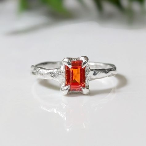 Show your Love with our new fiery Sapphire ring - uniquely handcrafted in molten wax and cast in Solid 14k Gold, our stunning ring features a radiant cut Orange Sapphire set on an organic molten textured band - a one of a kind engagement ring or a unique gift for that very special person in your lifeT H E ∙ S M A L L ∙ D E T A I L S• Radiant cut Orange Sapphire (6 x 4mm)• Solid 14k Gold textured bandM A T E R I A L ∙ O P T I O N S• Sterling Silver• Solid 14k GoldYou will receive a ring very simi Orange Sapphire Ring, Cut Orange, Textured Ring, Orange Sapphire, Radiant Cut, Tiaras And Crowns, Gold Texture, Special Person, Unique Rings