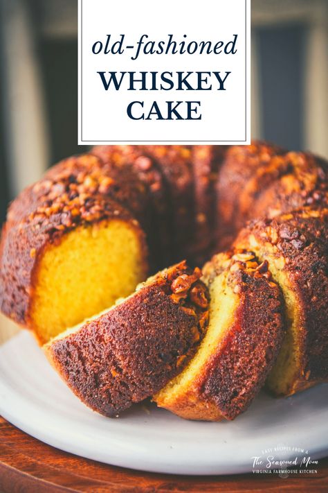 A perfect celebratory dessert for the holidays! This easy whiskey cake recipe starts with a box of cake mix for a moist, flavorful, and quick yellow Bundt cake that's topped with walnuts and soaked with a rich, butter-whiskey glaze. The old-fashioned treat has been a favorite for generations! Yellow Bundt Cake, Whiskey Desserts, Whiskey Cake Recipe, Whisky Cake, Bourbon Cake, Whiskey Glaze, Old Fashioned Whiskey, Whiskey Cake, The Seasoned Mom