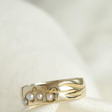 TED&MAG Jewelry on Instagram: "Introduce our new Lily of the valley ring!✨ Lily of the valley symbolizes a return to happiness and luck🍀 This lily of the valley ring was inspired by the purity of flowers. Leaves, stems and flowers are carved like a painting on a glossy band. On the flower piece, we delicately set soft and white pearls like the shape of a lily of the valley. If you are looking for a timeless piece, we recommend this ring✨" Lilly Of The Valleys, Lily Of The Valley Ring, Lily Of The Valley Necklace, Lily Of The Valley Jewelry, Lily Of Valley Jewelry, Lily Of The Vally Necklace, Lilly Of The Valley Jewellery, Lily Of The Valley Jewelry Ring, Lily Of The Valley Brooch