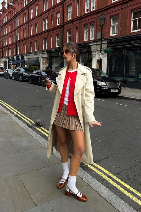 @keziacook is wearing Sézane Gaspard red knit cardigan and Paula babies with socks. The beige trench, white t-shirt and short checked skirt are personal pieces. Nordic Outfit, Sezane Gaspard, Knitted Dress Outfit, Preppy Summer Outfits, Modieuze Outfits, Chic Outfit, How To Pose, Autumn Outfit, Outfit Inspo Fall