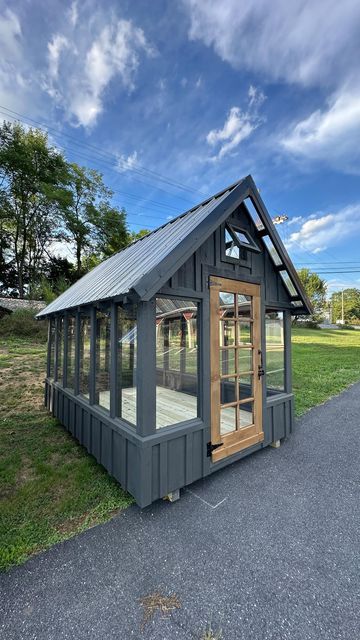 Screened In Shed, Outdoor Glass House, Garden Sheshed, Craft Sheds, Black Greenhouse, She Shed Makeover, Board Batten Siding, Stained Front Door, Rustic Shed