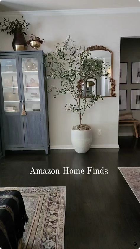 The best faux Olive tree from Amazon, faux tree,  olive tree,  moody living room, living room,  moody dark paint Best Faux Olive Tree, Indoor Olive Tree, Living Room Decor Styles, Moody Living Room, Artificial Olive Tree, Living Room Decor On A Budget, Faux Olive Tree, Washing Walls, Garden Fire Pit