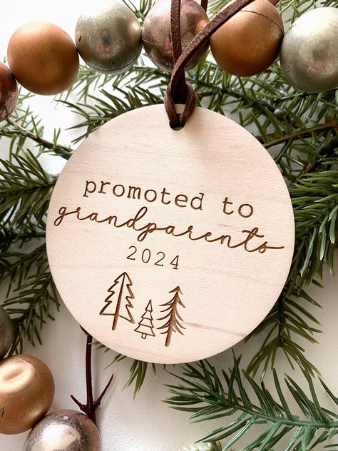 This listing includes 1 Christmas ornament, laser cut and engraved.   This is a great gift to give your parents as a baby announcement idea! The maple disc will be designed and laser cut using the fonts shown in the picture.  Size: 3.25" diameter Material: maple  WHEN WILL MY ITEM BE READY? We try to stay on, or ahead of schedule with our timelines listed on each listing. Please see the "ready to ship" timelines before purchase. SHIPPING IN CANADA In an effort to keep our prices as low as possib Diy Grandparent Ornaments, Christmas Pregnancy Gift Announcement, Christmas Baby Announcement To Parents, Baby Announcement Christmas Ornament, Expecting Baby Ornament, Baby Announcement Christmas Gift, Baby Announcement Ornament, Laser Baby Gifts, Christmas Engraving Ideas