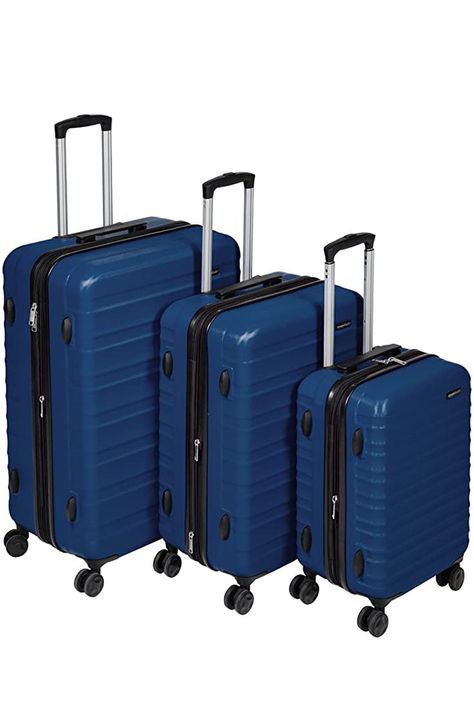 Hardside spinner luggage for work travel, vacations, or as international carry-on. Includes 3 spinners (21-, 26-, and 30-inch) with a protective extra-thick ABS hard shell and scratch resistant navy blue finish. 4 double spinner wheels ensure smooth-rolling mobility in any direction. Sturdy telescoping handle and a securely mounted short handle Product dimensions: 10 x 14.9 x 22 inches, 11.4 x 18.3 x 26.7 inches, and 12.7 x 21 x 30.7 inches (LxWxH, including wheels). Hardside Luggage Sets, 3 Piece Luggage Set, Hardside Spinner Luggage, Amazon Basics, Amazon Store, Suitcase Traveling, Luggage Sets, Work Travel, Business Travel