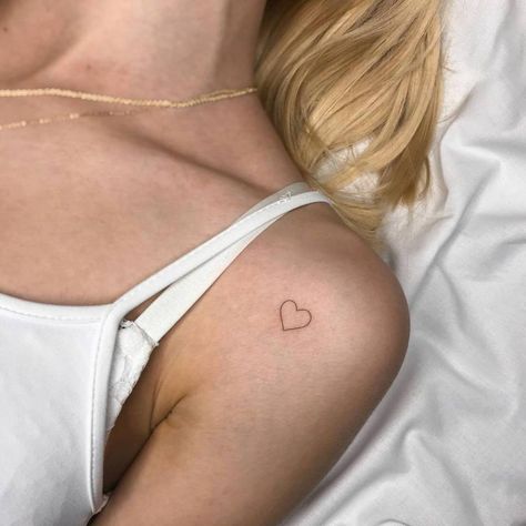 Heart Tattoo Under Collarbone, Upper Arm Heart Tattoo, Love Heart Tattoos For Women, Small Red Heart Tattoo On Chest, Heart Tattoo Small Arm, Heart Tattoo On Shoulder For Women, Shoulder Tattoo Heart, Minimal Tattoo Heart, Minimalist Tattoo On Shoulder