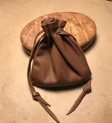 "This leather drawstring pouch bag is so soft and supple and will only get better with age. Made using Italian Lambskin leather.  This leather is hand selected to ensure you are getting the very best quality when I make my products. Color -Light Brown Medium Pouch - Over all size approx - 6. 1/2\" H X 5 1/2\"W.Pull draw string to close at top. Back to shop - http://www.etsy.com/shop/shirlbcreationstoo Read Customer Reviews from Shirlbcreationstoo customers here: http://www.etsy.com/people/onered Leather Drawstring Pouch, Custom Drawstring Bags, Distressed Leather Bag, Spirit Bags, Mens Pouch, Mens Leather Necklace, Medicine Pouch, Pouch Bags, Sack Bag