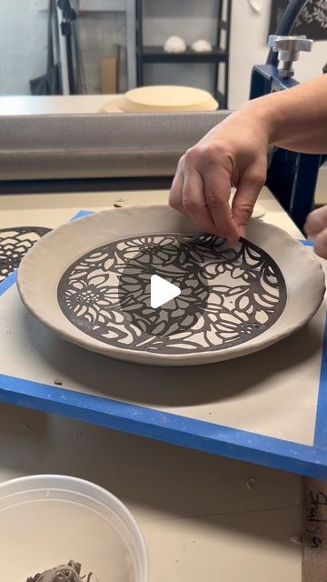 Shalya Marsh on Instagram: "A quick test using my revised floral stencil cut in 15# tar paper. I find that most of the time I need at least three versions before I have a design that checks all the boxes in terms of aesthetics and functionality.  I still need to see how this texture turns out after being glazed and there are always more improvements that can be made. Today I plan to cut a few of the new designs in Tyvek and make some tests using slips and water etching. 

✨✨✨
First, I roll a slab and then position the stencil. A small roller helps to press the stencil into the clay.  The clay is then lined up and pressed over a circular 8.5 inch @gr.pottery.forms . When the clay has stiffened up to leather hard the form is removed and the tar paper stencil is taken off to reveal the design Slip Stencil Pottery, Ceramic Stencil Ideas, Stencil Text, Floral Stencil, Surface Decoration, Use Me, New Designs, Etching, Good Times