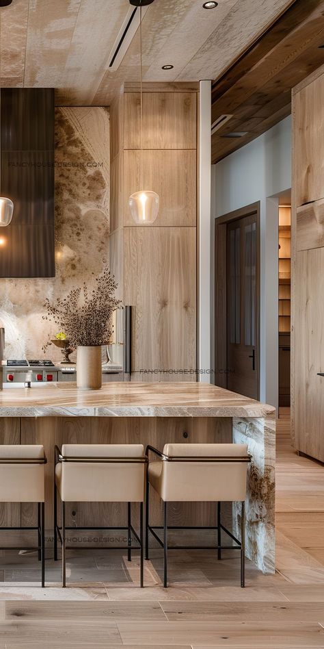 The luxurious kitchen design features a large, central island and exquisite pendant lighting. Counter Tops, A Kitchen, Marble, Design