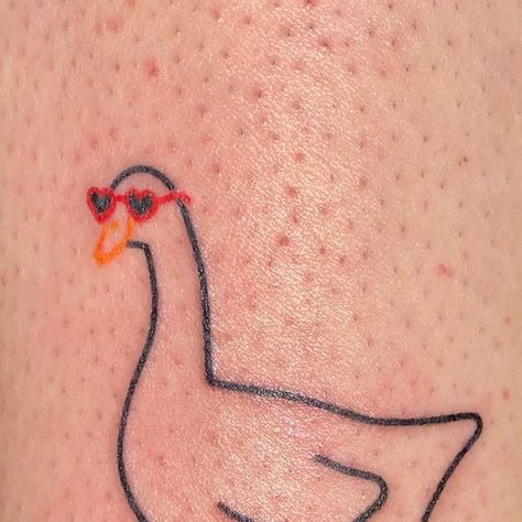 Patrycja ✿ handpoke tattoos ❋ Wrocław on Instagram: "That cute goose spent the whole summer in those heart shaped glasses and had to wait till now to be published. Give her some love 🦆❤️ ______ GUEST SPOTS: 🇫🇷 Paris 20-22.03 DM to book 💌 #handpoke #cutetattoo #stickandpoke #polandtattoos #wroclawtattoo #wroclove #paristattoo #francetattoo #frenchtattoo #lyontattoo #goosetattoo #ducktattoo #heartglasses #birdtattoo #polskietatuaze #kawaiitattoo" Goose With Glasses Tattoo, Silly Goose Tattoo Matching, Mother Duck Tattoo, Duck With Sunglasses Tattoo, Funny Goose Tattoo, Heart Shaped Glasses Tattoo, Goose Outline Tattoo, Heart Shaped Tattoos, Goose Doodle