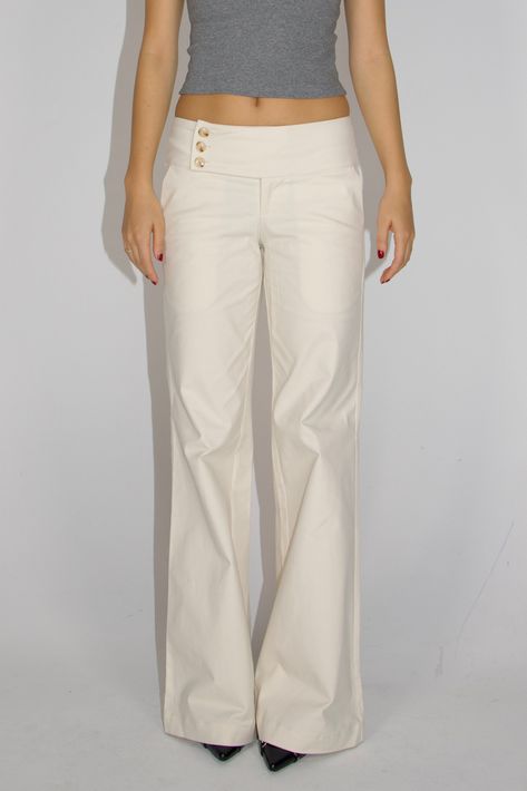 These low-rise, wide-leg cargo pants evoke early 2000s style and can be paired with any top to elevate your outfit. Features Designed to accentuate your curves and showcase the natural contours of your body. Highlighted by three meticulously crafted luxury buttons along the waistband, adding a touch of sophistication to enhance your appearance. Crafted from a smooth cargo material, they gracefully keep the pants in shape and embrace your figure. The low/mid-waisted design with a straight or wide Chic Things List, Low Waist Tailored Pants, Low Waist Linen Pants, White Dress Pants Outfit Classy, White Bottoms Outfit, White Corduroy Pants Outfit, Low Waisted Trousers, Low Rise Cargos, Cute Cargo Pants