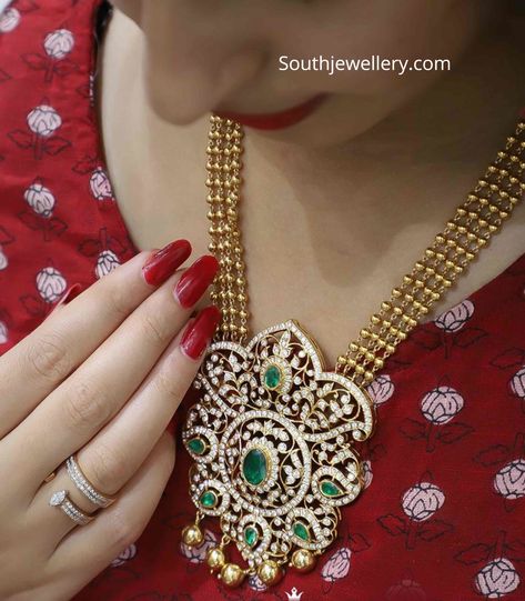 22k gold four line gold balls necklace with closed setting diamond emerald pendant by Raj diamonds, Bangalore.  gundu mala with pendant Indian Designs, Long Haram, Necklace With Diamond, Diamond Pendants Designs, Gold Jewelry Simple Necklace, Diamond Pendant Sets, Beautiful Gold Necklaces, Diamond Necklace Designs, Gold Necklace Indian Bridal Jewelry