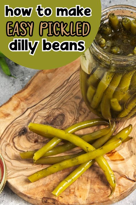 These Dilly Beans, also known as pickled green beans, are crunchy, flavorful and oh-so-addictive. Just a few simple ingredients and 10 minutes to make! Dilly Beans Recipe, Pickled Green Bean Recipes, Preserving Green Beans, Pickled Beans, Quick Pickle Recipe, Quick Pickle, Pickled Green Beans, Dilly Beans, Csa Box