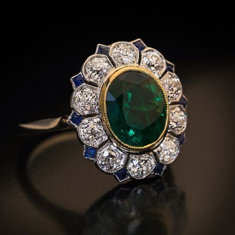 4,066 Likes, 57 Comments - Romanov Russia Antiques (@romanov_russia) on Instagram: “This Art Deco ring c.1930 is centered with an alpine green emerald framed by old European cut…” Luxury Art Deco Jewelry With Halo Design, Art Deco Emerald Ring With Halo Setting, Luxury Green Art Deco Ring, Collectible Art Deco Emerald Gemstone Ring, Green Emerald-cut Art Deco Diamond Ring, Art Deco Jewelry Rings, Art Deco Emerald Ring, Diamond Sapphire Ring, Art Deco Sapphire Ring