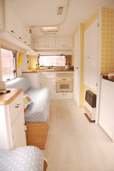 N2S - I like this look for my caravan makeover, the yellow and white is clean, and faded denim blue on the squabs looks casual and fresh. Will add white and pink/purple/yellow granny square quilts and a honey-coloured pine floor.  Overhead cupboards in brown formica can stay. Bus Cafe, Caravan Interior Makeover, Fiberglass Camper, Laying Laminate Flooring, Caravan Vintage, Motorhome Interior, Camper Interior Design, Caravan Makeover, Touring Caravan