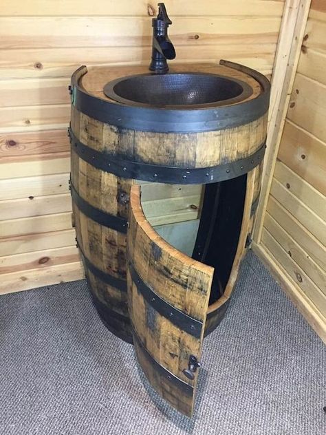 "Unique rustic barrel sink made from a reclaimed whiskey bourbon barrel. Can be used as a bathroom vanity, or a sink in a bar room. This version of the barrel vanity has a flat back that goes against the wall snugly. The back has holes cut for plumbing to be conveniently hooked up for the sink and faucet. SHIPS FREE TO THE LOWER 48 states. This product will take 2-3 weeks to receive. These vanities are made from Grade A barrels. Please note that these are made from Oak, and this wood will shrink Wine Barrel Sink Bathroom, Barrel Sink Bathroom, Wine Barrel Sink, Whiskey Barrel Decor, Whiskey Barrel Sink, Barn Bar, Barrel Sink, Whiskey Barrel Furniture, Sink And Faucet