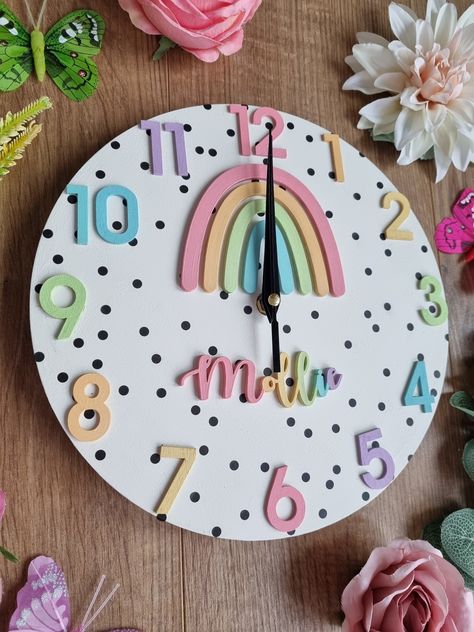 Handmade wooden rainbow clock This pretty pastel wooden rainbow clock can be personalised with wording of your choice.  It is hand painted in pretty pastel colours, backed in polka dots and lovingly assembled. This clock makes perfect decor for a rainbow themed nursery or kids room.  This wooden clock is lovingly made to order and thus colours can be changed if required. Please feel free to contact me, I am always willing to customise your order. Please note this item is not a toy and is for dec Pastel Rainbow Room, Clock Learning, Rainbow Room Decor, Dot Rainbow, Rainbow Bedroom, Big Girl Bedrooms, Rainbow Room, Wooden Rainbow, Learning Time