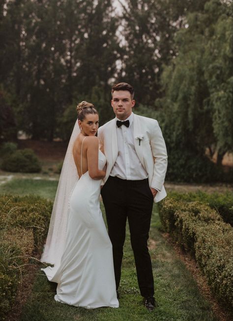 Black and white wedding simple wedding dress black and ivory tux White Tux Black Shirt, Groom White Suit Wedding, Groom White Jacket Black Pants, Black And White Wedding Groom, White Tux Jacket Black Pants Groom, White And Black Tuxedo Wedding, Black And White Wedding Suit, White And Black Suit, Groomsman Outfits