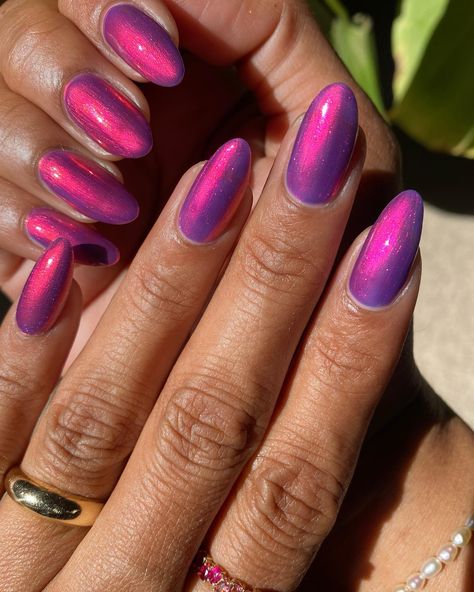 Posted by Zoe Scott: Welcome to my world of color and creativity, where today we're diving into the charming realm of pink and purple nails! If you're anything like me, yo... Gel Nails Holographic, Fuschia Purple Nails, Taylor Swift Chrome Nails, Pink And Purple Cat Eye Nails, Vibrant Purple Nails, Purple Pink Chrome Nails, Majenta Color Nail Art, Purple And Pink Nails Ideas, Purple Chrome Nails Almond