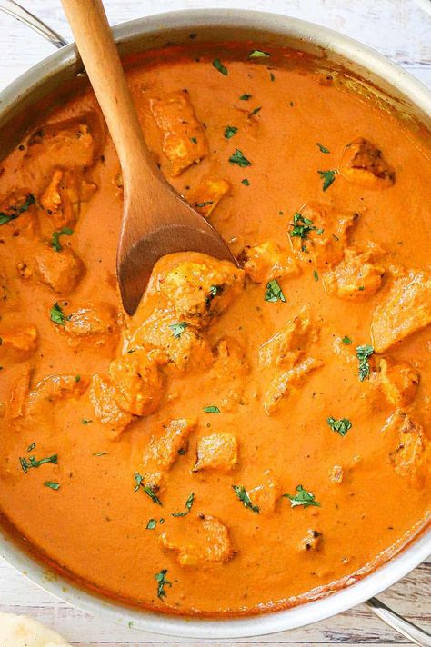 An overhead view of a large silver saucepan filled with creamy chicken tikka masala with a wooden spoon resting in the sauce. Tikka Masala Sauce, Yogurt Marinade, Chicken Tikka Masala Recipes, Masala Sauce, Ginger Sauce, Chicken Masala, Chicken Tikka Masala, Chicken Tikka, Tikka Masala