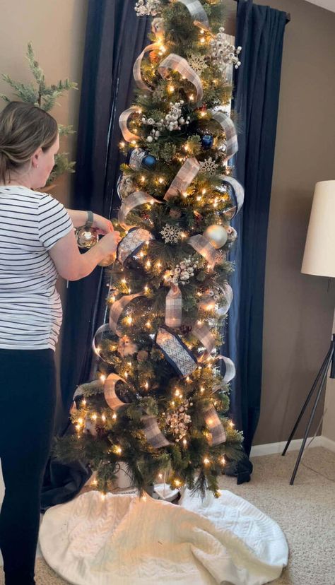 If you’ve ever considered a skinny tree, but were hesitant because you weren’t sure how to decorate it, today’s your lucky day!I created the most detailed recap of how I decorated our skinny tree in this post and the best part?It was so easy!! Let's get to it! Pre-Decorating TipsThere are a couple of things to consider before you dive into decorating your tree.First things first, you want to pick a Christmas color scheme.This will help you create a cohesive look, even if it’s just fo… Pencil Trees Decorating Ideas, Christmas Tree With Ribbon, Tree With Ribbon, Christmas Tree Decorating Tips, Christmas Checklist, Pencil Tree, Christmas Colour Schemes, Slim Christmas Tree, Pencil Trees