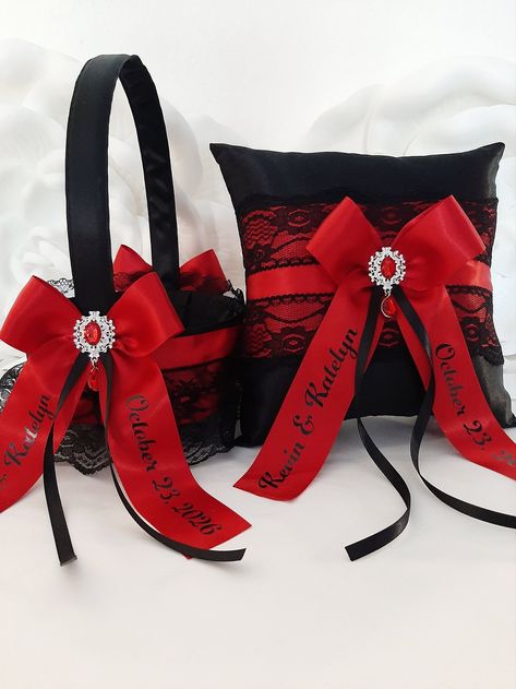 Black and Red Wedding Decor, Flower Girl Basket and Ring Bearer Pillow Set, Wedding Ceremony Accessories, Bridal Garter, Cake Server and Knife Beautiful wedding set! Made with black satin, red and black ribbons and bows, black lace and beautiful silver-tonned brooches. Please, choose your accessories in a drop down menu, put preferable items in your card, choose quantity, add personalization (if needed) and checkout them together. Personalization: Please enter your text in the Personalization box at the checkout.  **Write "none" if you don't need personalization** ❤ Ring Bearer Pillow measurements: 7,5 inches x 7,5 inches. ❤ Flower Girl Basket measurements: 6 inches in diameter. Around 9 inches tall. ❤ The Cake Serving Set includes one 13.5" long cake knife and one 11" long cake server. ❤ Rustic Black And Red Wedding, Black Red And Silver Wedding Theme, Black And Red Goth Wedding, Red And Black Western Wedding, Black And Red Centerpieces Wedding, Black And Red Wedding Theme Receptions, Red And Black Gothic Wedding, Black Red And Orange Wedding, Wine Red And Black Wedding Theme