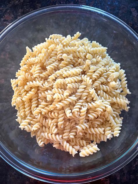 Want to learn How To Cook Pasta In The Microwave? It's super easy! And the pasta comes out perfectly cooked. You'll love the convenience of this recipe. Microwave Pasta Cooking pasta in the microwave is a super fast and easy way to whip up a tasty meal. It saves time because you don't have to wait for a big pot of water to boil on the stove. All you need is a microwave-safe bowl, some water, and your favorite pasta. It's a great option for when you're feeling hungry and don't want to wait ... Pasta In Microwave Cook, Pasta In The Microwave, Microwave Rice Krispie Treats, Pasta In The Instant Pot, Microwave Pasta, Best Potato Salad, Best Potato Salad Recipe, Dorm Food, Cooking Spaghetti