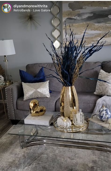 Blue Cream Living Room Ideas, Navy Blue Grey Gold Living Room, Gray Blue And Gold Living Room, Navy Blue Gray And Gold Living Room Ideas, Blue And Gold Apartment Decor, Gray Accent Wall Living Room, Gray And Gold Living Room, Gold Coffee Table Decor, Grey Accent Wall Living Room