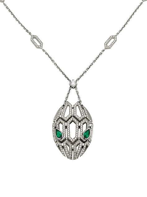 From the Serpenti Seduttori Collection. Capturing the snake's innate power of attraction, the Serpenti pendant glorifies the head of the mythical animal, focusing on the magnetic power of the eyes. A striking diamond station necklace cast in gleaming 18K white gold with emerald eyes and pavé diamonds. Diamonds, 2.63 tcw Emeralds, 0.96 tcw 18K white gold Lobster clasp Made in Italy SIZE Adjustable length, about 16.9"-17.7" ABOUT THE BRAND Founded in Italy in 1884 by Greek silversmith Sotirio Bulg Bvlgari Necklace Snake, Bvlgari Necklace, Emerald Pendant Necklace, Power Of Attraction, Bulgari Jewelry, Emerald Necklace Pendant, Bvlgari Jewelry, Bvlgari Serpenti, White Gold Pendant Necklace