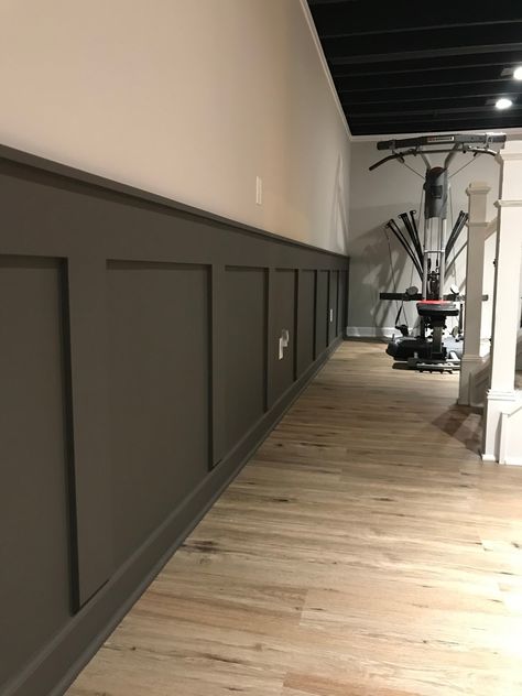 DIY Basement Ideas Basement Two Tone Walls, Dark Wainscoting Basement, Wood Basement Walls, Beadboard Half Wall Basement, Half Wall Ledge Basement, Basement Wall Treatments, Two Tone Basement Walls Paint Ideas, Diy Basement Renovation, Dark Wall Basement Ideas