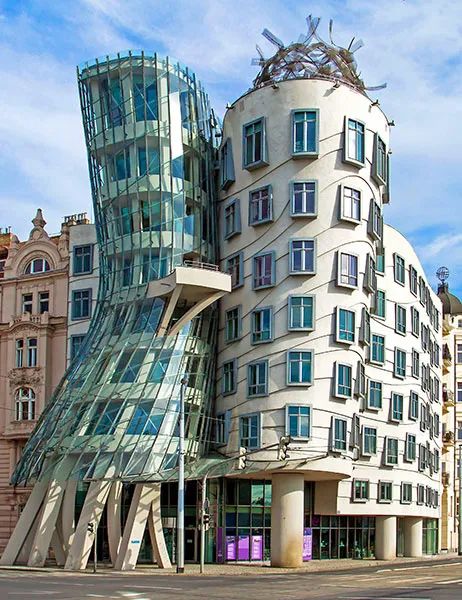 Frank Gehry Buildings and Architecture | Architectural Digest Deconstructivism Architecture, Architecture Futuristic, Frank Gehry Architecture, Gehry Architecture, Building Green, Futurist Architecture, Architecture Cool, Santiago Calatrava Architecture, Dancing House