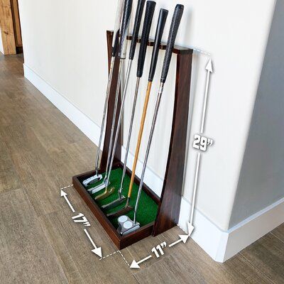 GoSports Premium Wooden Golf Putter Stand, Holds 6 Clubs | Gosports Premium Wooden Golf Putter Stand, Holds 6 Clubs Solid Wood in Brown, Size 29.0 H x 17.0 W x 11.0 D in | Wayfair Golf Closet, Wooden Golf Clubs, Golf Furniture, Golf Room, Golf Diy, Golf Putter, Twin Headboard, Golf Putters, Golf Practice