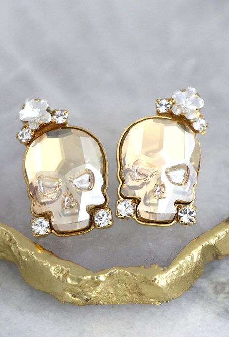 Skull Earrings Sugar Skull Earrings Skull Stud Earrings Click here to shop >> https://etsy.me/2gYMNax #bridalearrings #giftsforher #bridesmaidearrings #SWAROVSKIearrings #ETSYhandmade #Luxuryearrings #crystalearrings #crystalbridalearrings #weddingdayearrings #PetiteDelights Earrings Skull, Corporate Goth, Gothic Bride, Sugar Skull Earrings, Earrings Gothic, Rock N Roll Bride, Crystal Bridal Earrings, Bride Jewelry, Bride Earrings