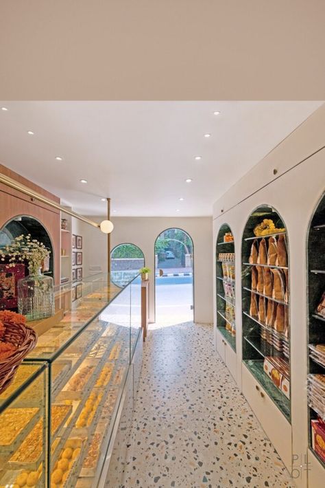 A Confectionery Store With Linear Language And Striking Material | The Plot Studio - The Architects Diary Sweet Shop Design Interiors, Namkeen Shop Interior Design, Mithai Shop Interior Design, Dairy Shop Interior Design, Sweet Shop Interior Design Indian, Sweet Shop Interior Design, Sweet Shop Interior, Indian Sweet Shop, Shop Board Design