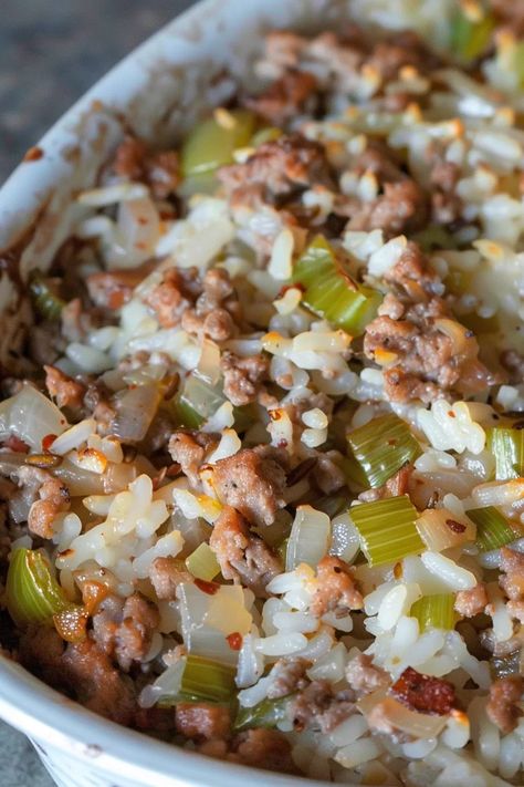 Enjoy this Flavorful Jailhouse Rice with ground beef, sausage, and rice in a creamy blend of broth and celery soup. Comfort in every bite! Jailhouse Rice, Sausage Rice Casserole, Rice With Ground Beef, Sausage And Rice Casserole, Soup Comfort, Sausage And Rice, Rice Side Dish Recipes, Cream Of Celery, Creamy Rice