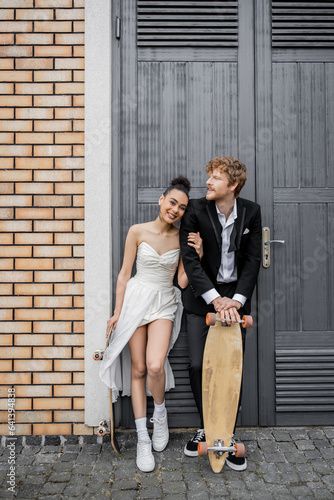 Stock Image: interracial couple in wedding attire, with longboard and skateboard near doors of city building Easy Couple Poses Casual, Swanky Bar, Editorial Engagement Photos, Lesbian Engagement, Paris Couple, Portrait Photography Tips, Interracial Couple, Couples Portrait, Couple Picture