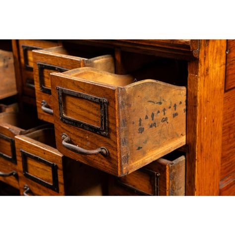 Quarter-sawn solid oak card catalog with 35 storage drawers of uniform size. The catalog portion detaches from the wheeled base for ease of transportation. Each drawer includes the original tin nameplates and iron drawer pulls.  Exhibits minor signs of wear and retains original varnish.  29.5" W x 23.5" D x 53.5" H Drawers (x35): 4.25" W x 20" D x 4" H Vintage Library Card Catalog, Library Card Catalog Cabinet, Vintage Library Card, Card Catalog Cabinet, Vintage Filing Cabinet, Iron Drawer Pulls, Library Card Catalog, Library Furniture, Card Catalog