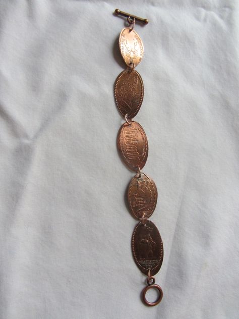 Could never figure out what to do with all those pressed pennies from vacations and travels, so I decided to make a bracelet out of them. Pressed Penny Bracelet, Smashed Penny Jewelry, Hammered Penny Jewelry, Jewelry Made From Coins, Pressed Penny Jewelry, Pressed Penny Tattoo, Pressed Pennies, Penny Bracelet, Vacation Memories