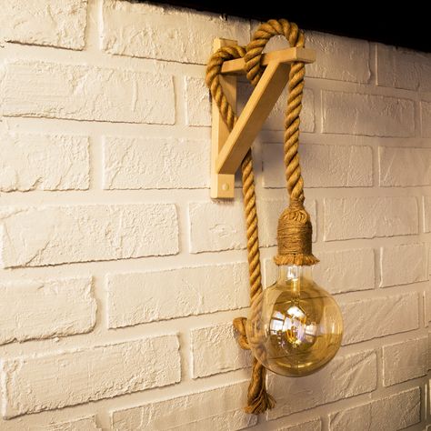 Retro style wooden sconce with twisted rope (Rope Lamp). This attractive lamp will go perfectly in any nautical, coastal or loft and urban themed room as a bedside reading light, wall lamp for living room, bedroom or entryway and add some quirky design to your space. With vintage look like led bulb is the perfect addition to your home or public place as pub, bar. Include: rope wall sconce ROPE LAMP DETAILS: Height ~ 55 cm (21,7 in).  Depth - 20 cm (7,9 in). Width - 7 cm (2.8 in) Lamp Holder - E2 Nautical Bar, Wooden Sconces, Nautical Lamps, Bedside Reading Light, Rope Lamp, Rope Wall, Sconces Living Room, Loft Stil, Wooden Pendant Lighting